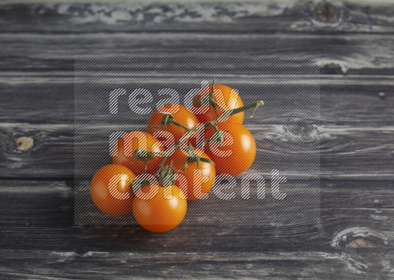 45 cherry tomato vein on a textured grey wooden background