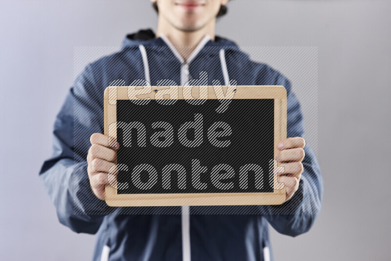 Man holding books and a board in different positions (back to school)