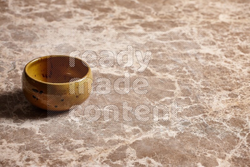 Multicolored Pottery Bowl on Beige Marble Flooring