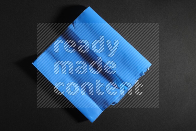 Colored plastic textures on black background