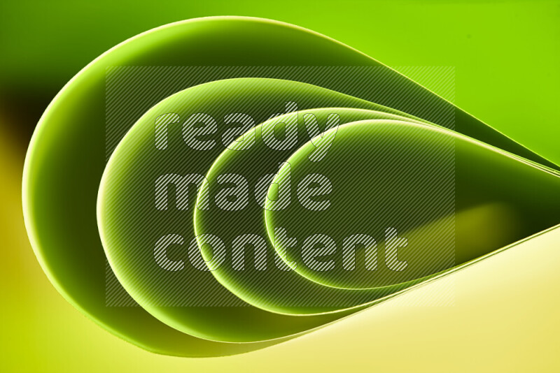 An abstract art of paper folded into smooth curves in green gradients