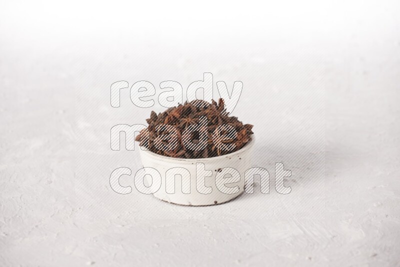 Star Anise in a white bowl on white background