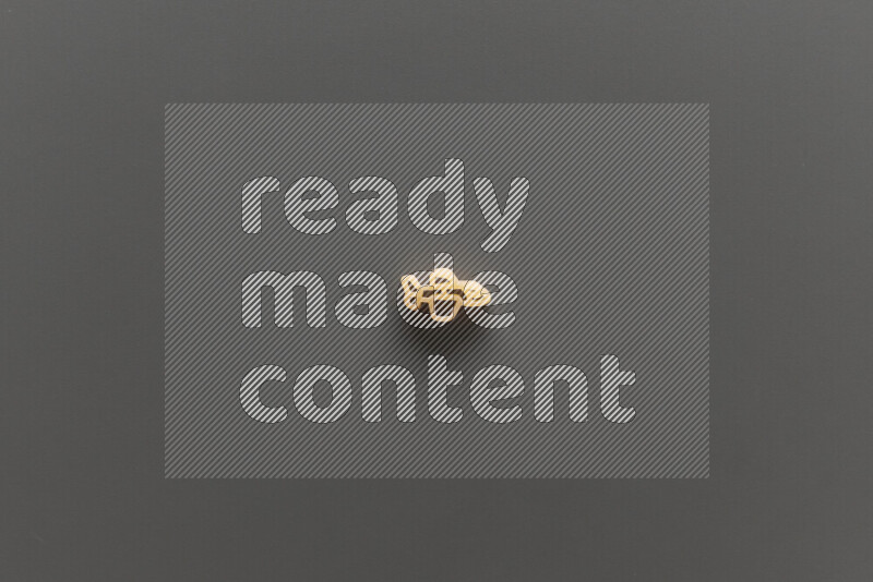 Shaped children pasta on grey background
