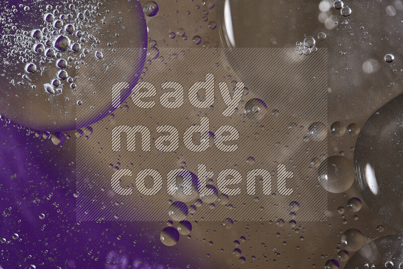 Close-ups of abstract oil bubbles on water surface in shades of purple and brown
