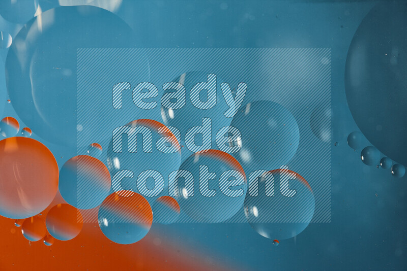 Close-ups of abstract oil bubbles on water surface in shades of blue and orange
