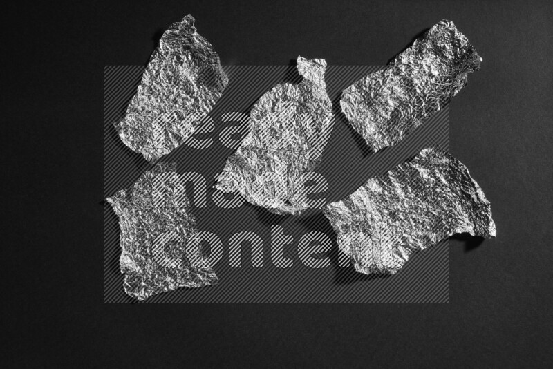 Aluminium foil on black background