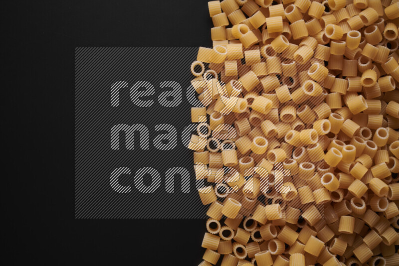 Different pasta types on black background
