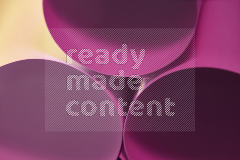The image shows an abstract paper art with circular shapes in varying shades of pink and warm tones