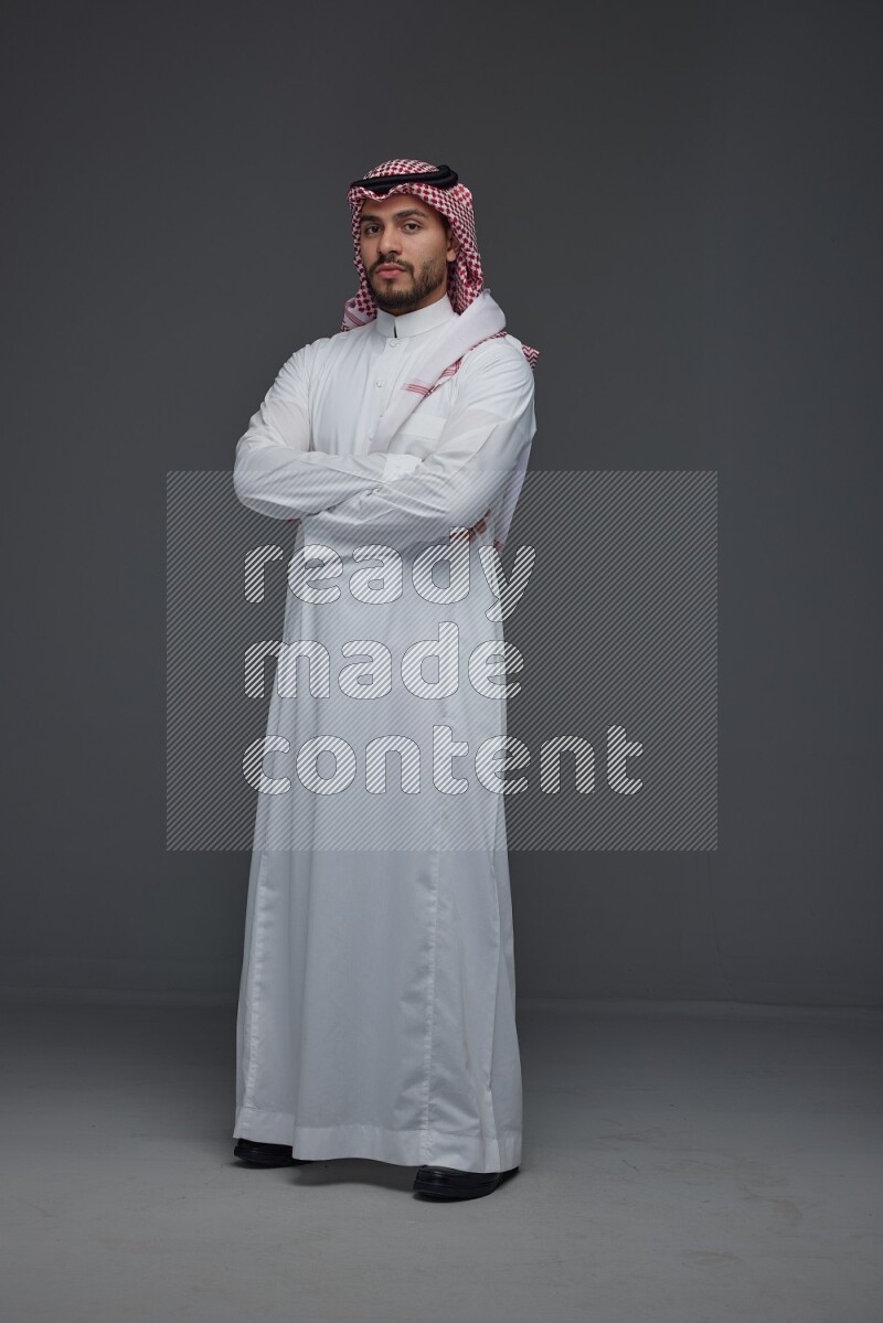 A Saudi man wearing Thobe and Shmagh standing in different poses eye level on a gray background