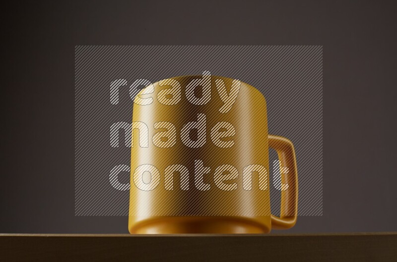 Low angle shot of a yellow cup on grey background