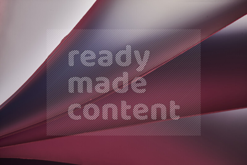 فن تجريدي يعرض منحنيات مع تدرجات الألوان الدافئة والباردة مكونه بضوء ملون