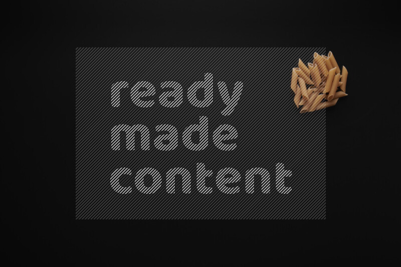 Different pasta types in bunches on black background