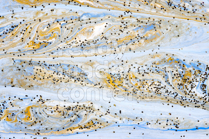 Abstract colorful background with mixed of blue, white and gold paint colors with scattered gold glitter