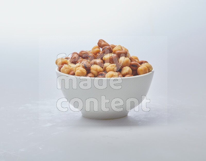 Close up shot of cooked fava beans (foul) & chickpeas on white background