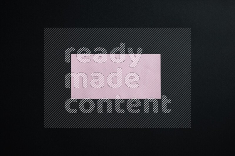 Pink paper sheet on black background