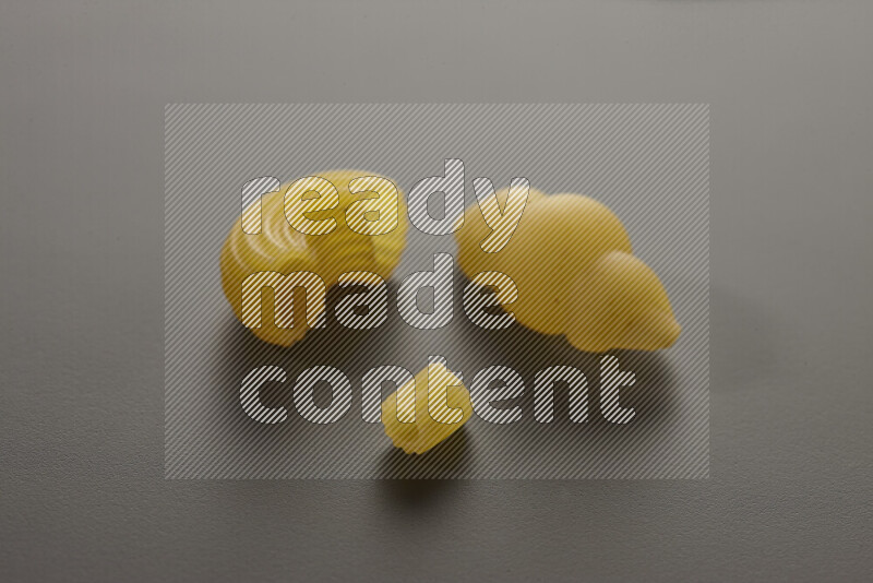 Different pasta types on grey background