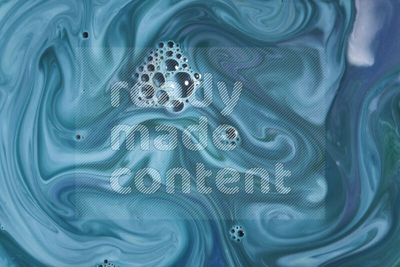 A close-up of abstract swirling patterns in blue and green