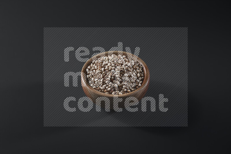 Black-eyed peas in a wooden bowl on grey background