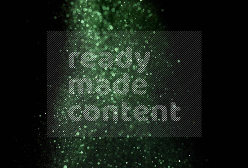 Green glitter powder isolated on black background