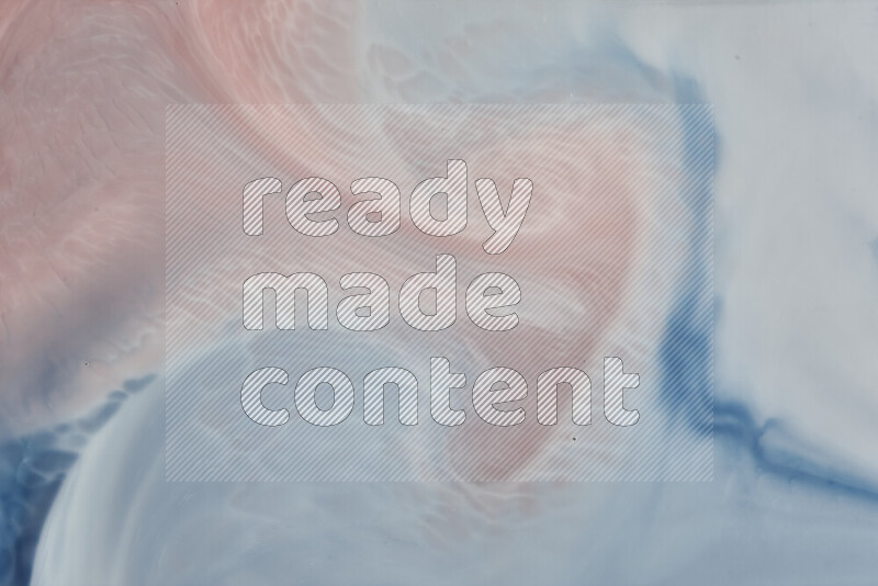 A close-up of abstract swirling patterns in blue, red and white