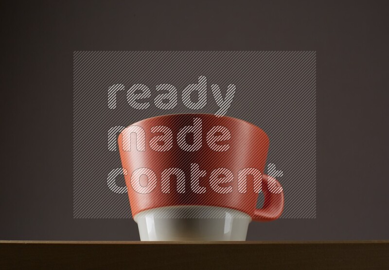 Low angle shot of a bicolor cup on grey background