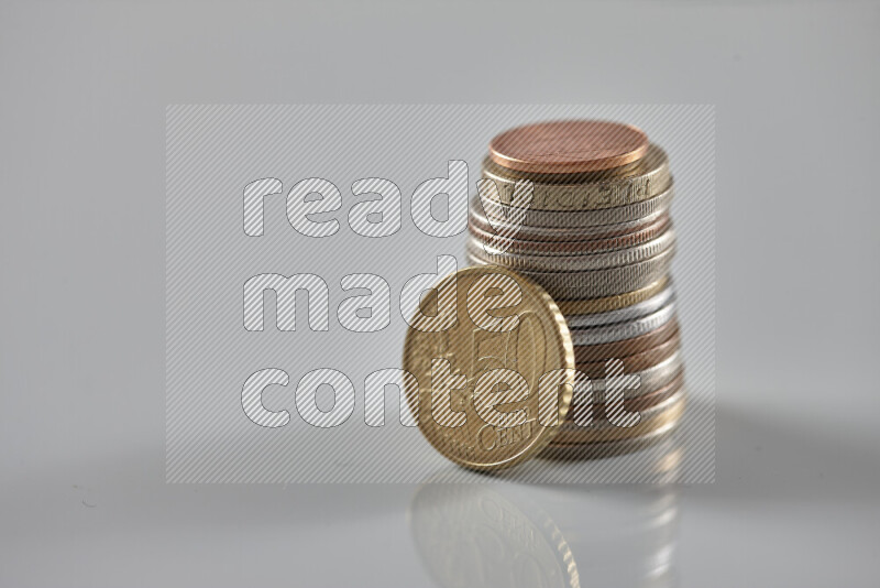 Random old coins on grey background