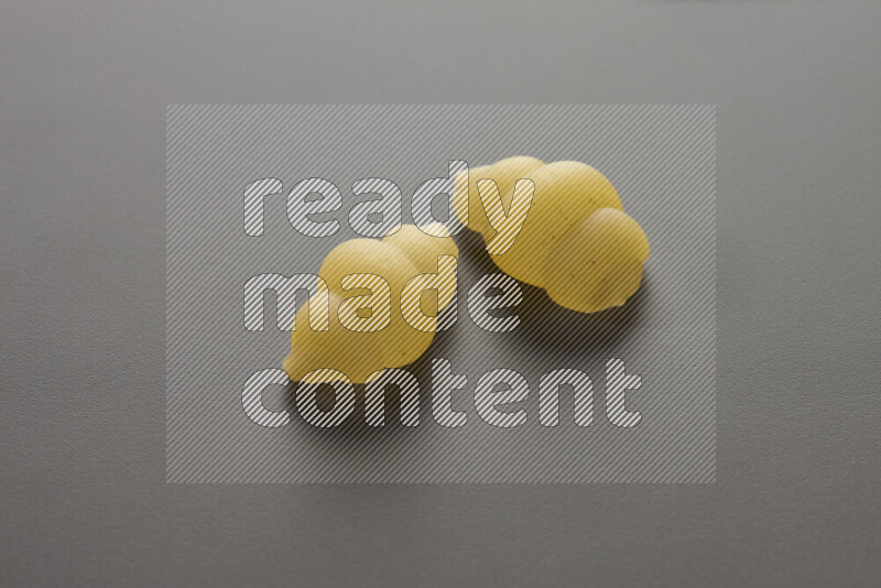 Snails pasta on grey background