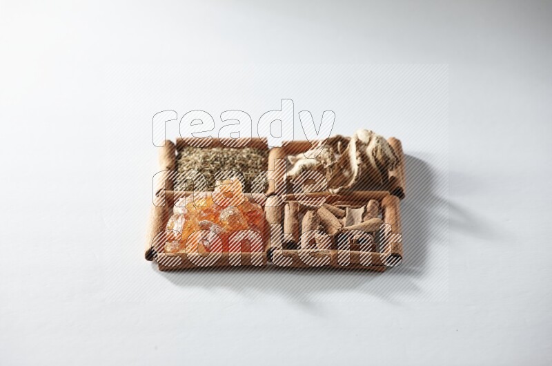 4 squares of cinnamon sticks full of cumin, cinnamon, dried ginger and gum arabic on white flooring