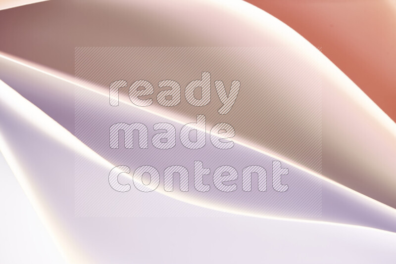 This image showcases an abstract paper art composition with paper curves in white and different warm gradients created by colored light