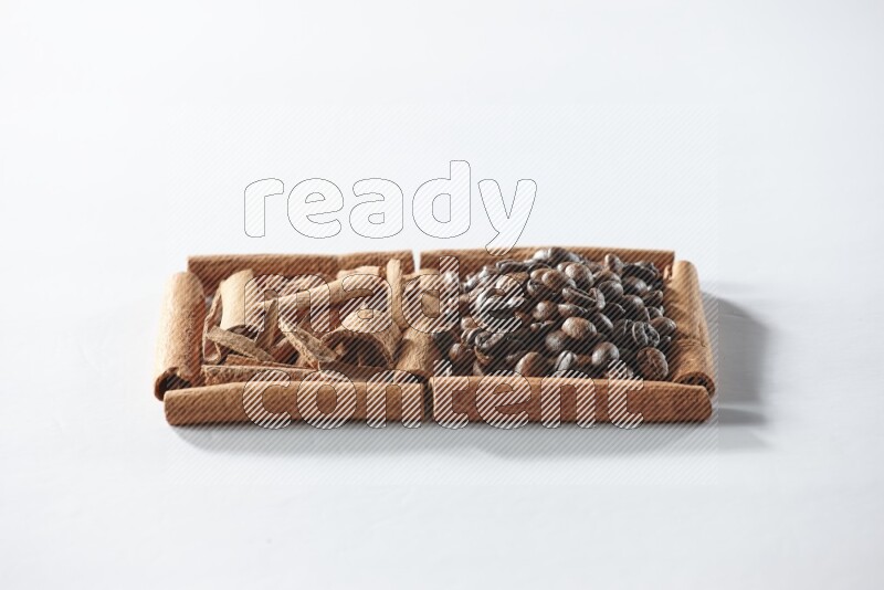 2 squares of cinnamon sticks full of coffee beans and cinnamon on white flooring