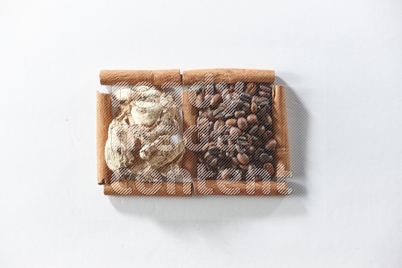 2 squares of cinnamon sticks full of coffee beans and dried ginger on white flooring