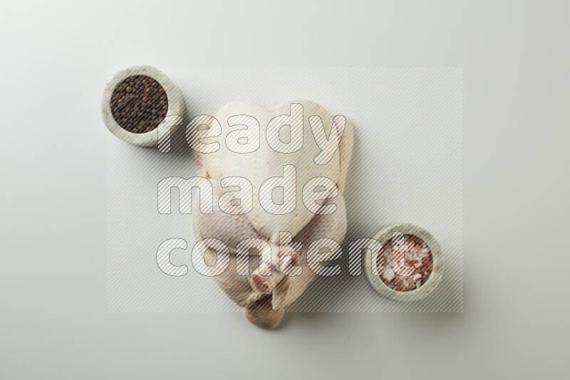 Whole fresh chicken direct on a white background