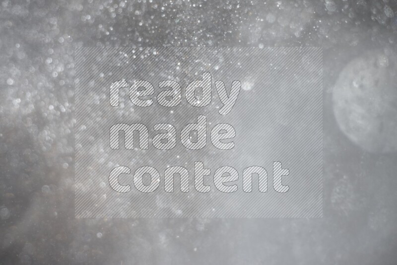 Silver glitter powder isolated on black background