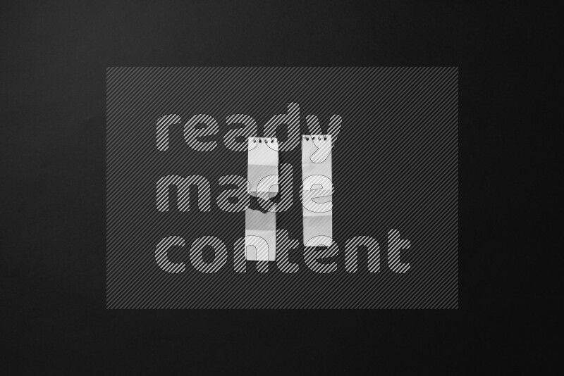 Ripped notebook sheet on black background