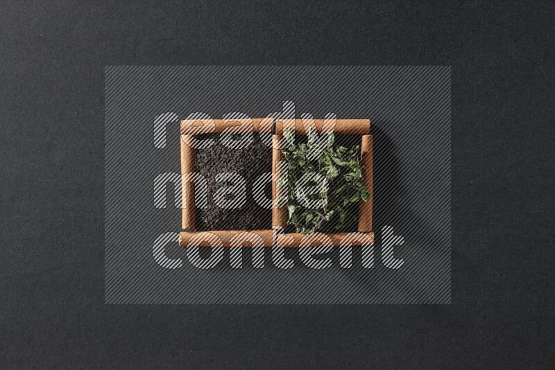 2 squares of cinnamon sticks full of tea and dried mint leaves on black flooring