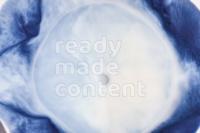 A close-up of abstract swirling patterns in blue and white