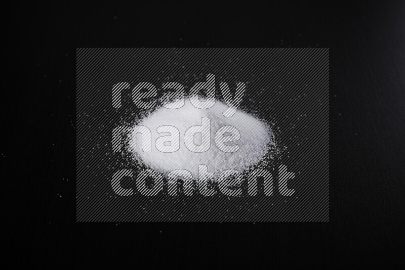 A bunch of fine table salt on black background