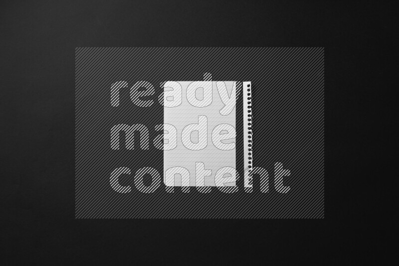 Ripped notebook sheet on black background