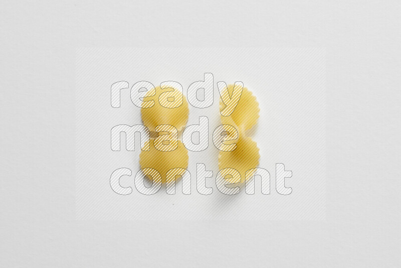 Fiocchi pasta on white background