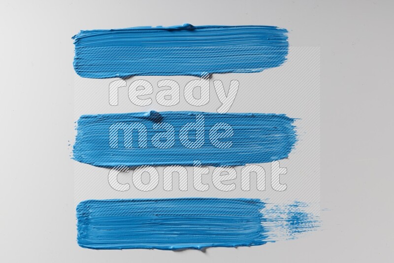 Blue painting brush strokes on white background