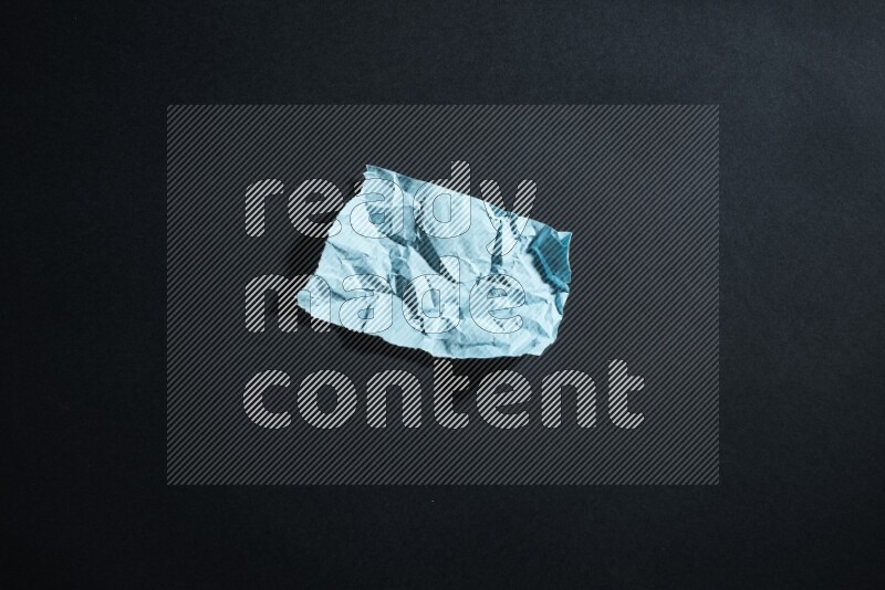 Blue paper sheet on black background