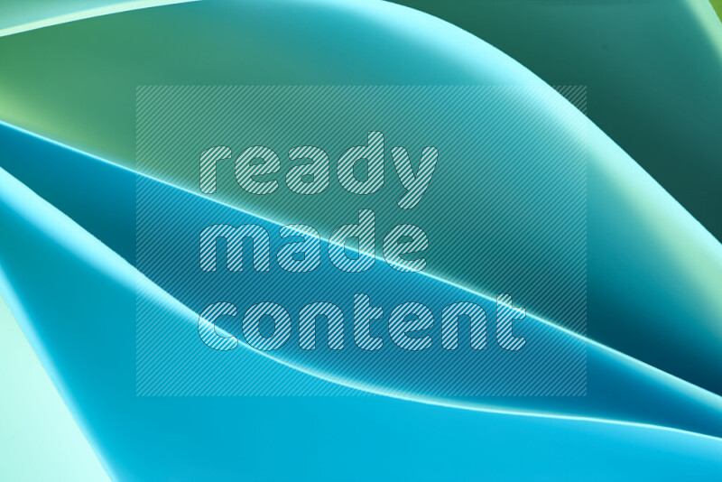 هذه الصورة تعرض تكوين فن الورق التجريدي مع منحنيات ورقية بتدرجات اللون الأخضر والأزرق المكونه بواسطة الضوء الملون