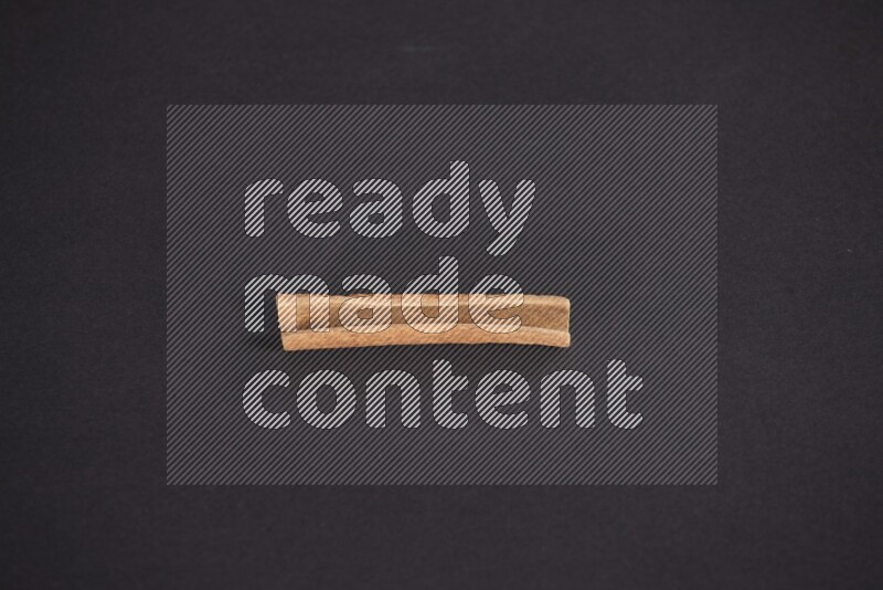 Cinnamon stick on black background