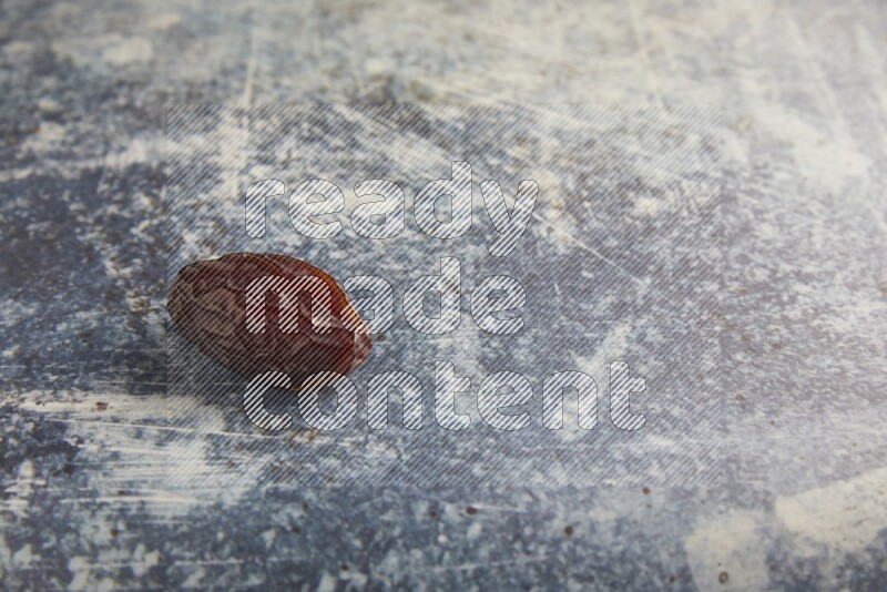 one madjoul date on a rustic blue backround