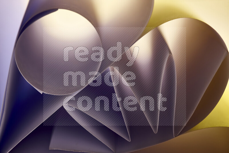 An artistic display of paper folds creating a harmonious blend of geometric shapes, highlighted by soft lighting in warm tones