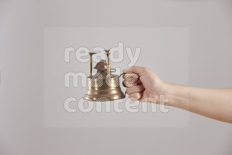 Woman hands holding different metal essentials in different positions