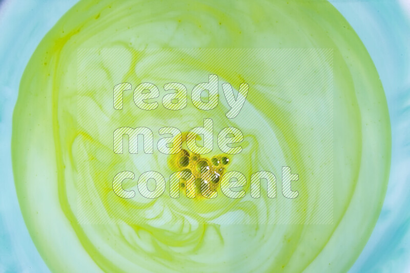 A close-up of abstract swirling patterns in green gradients