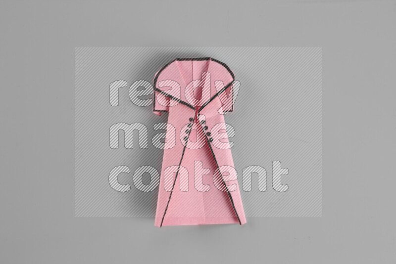 Origami clothes on grey background