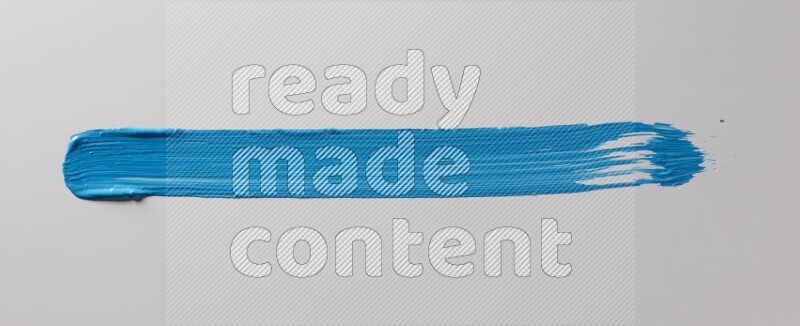 A single blue straight line brush stroke on a white background