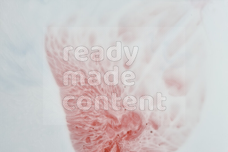 A close-up of abstract swirling patterns in red and white